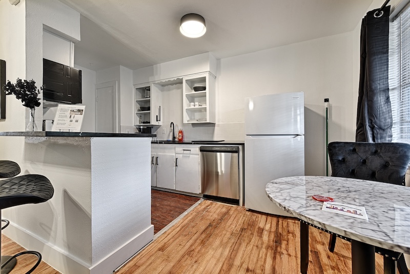 A full kitchen in a CityPlace bnb one-bedroom suite