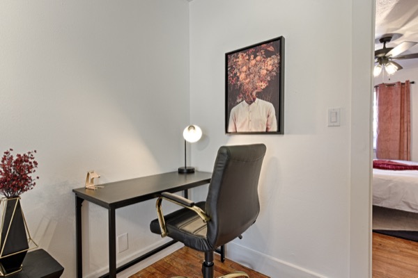 Desk with office chair and lamp in the suite workspace