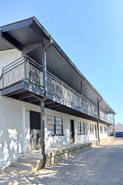 Second-floor exterior walkway and stair along the building facade