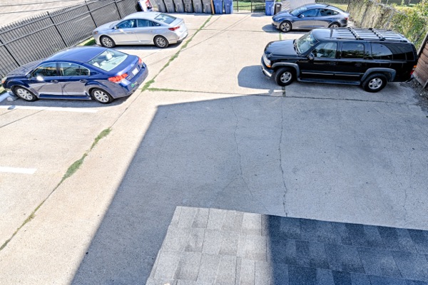 Private on-site parking lot behind the building